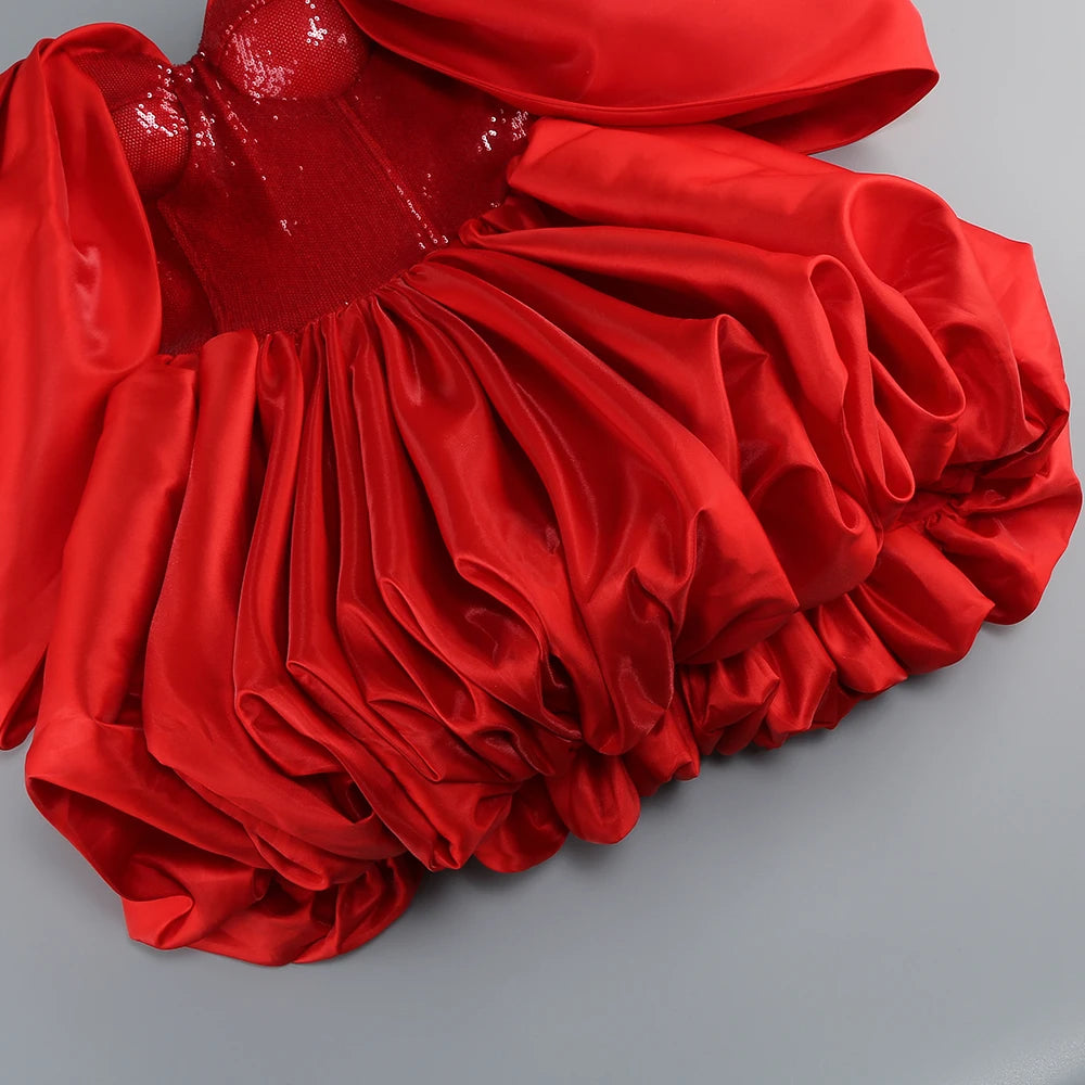 Red fabric with a textured surface on a gray background