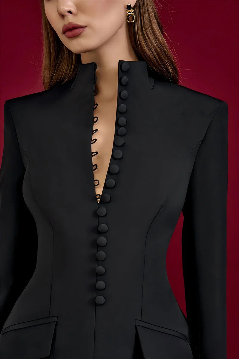 Black button-up garment on a red background