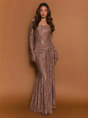 Woman wearing a long, elegant brown dress against a matching background