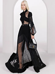 Black lace panel pleated maxi dress worn by a model