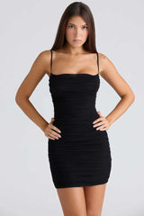Woman wearing a black dress - front view