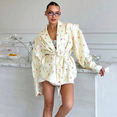 Woman wearing a floral robe in a kitchen setting