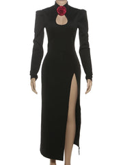 Black dress with a high slit and red flower detail