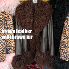 Brown leather jacket with brown fur trim on a rack.
