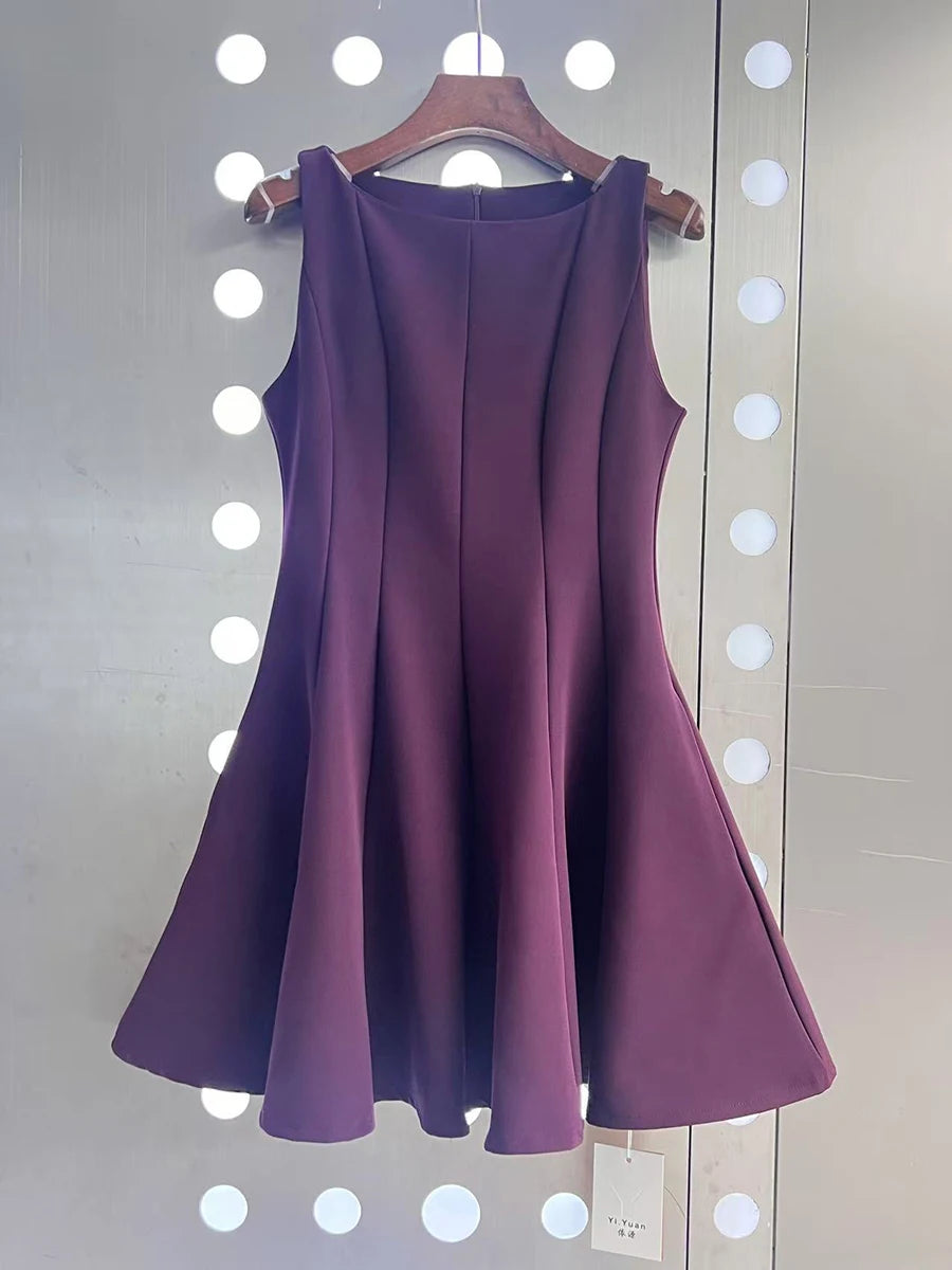 Purple dress on a hanger against a white background with circular lights