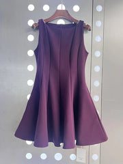 Purple dress on a hanger against a white background with circular lights