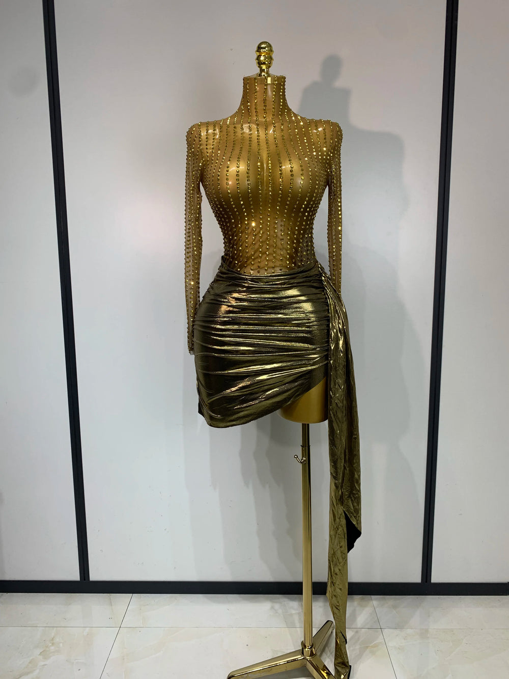 Gold long sleeve turtleneck mini dress with embellishments and draped skirt