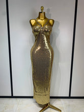 Gold glitter sequin column maxi dress with spaghetti straps.