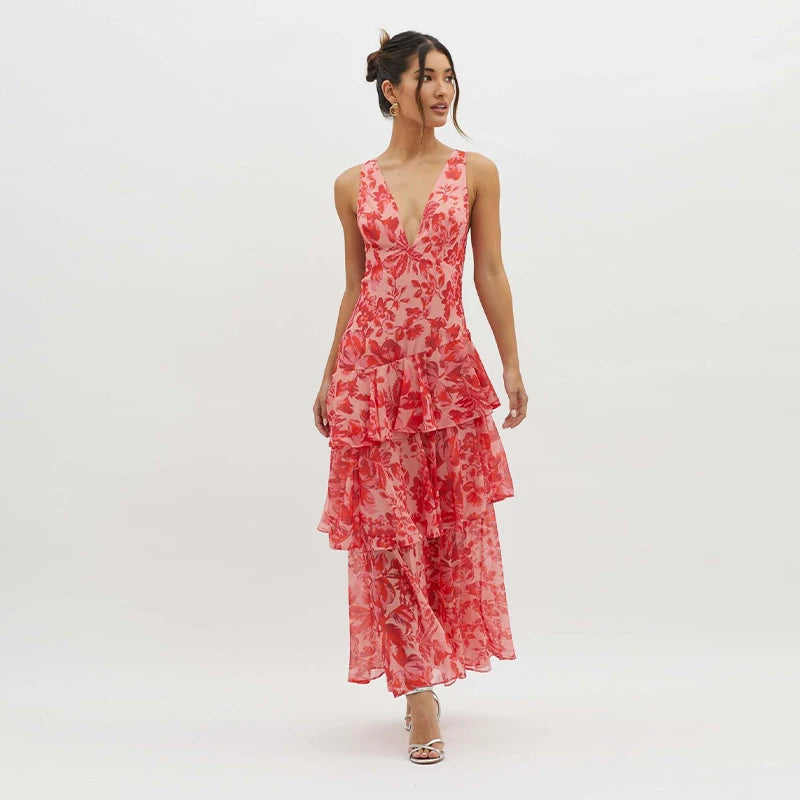 Woman wearing a red floral dress on a white background