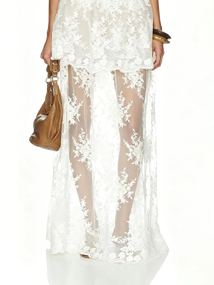 Detail of white sheer floral lace maxi skirt