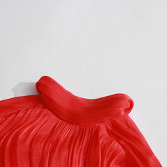 Close-up of a red garment with a white background