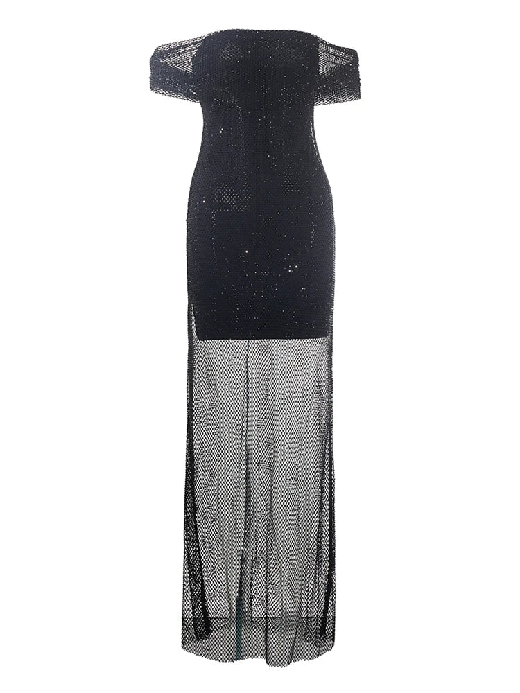 Black off-shoulder evening gown with sheer overlay on a white background