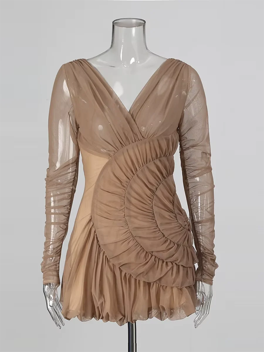 Beige dress on a mannequin against a plain background