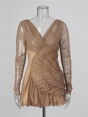Beige dress on a mannequin against a plain background