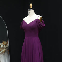 Purple dress on a mannequin against a black background