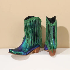 Green and blue sequin cowboy boots with fringes on a beige background