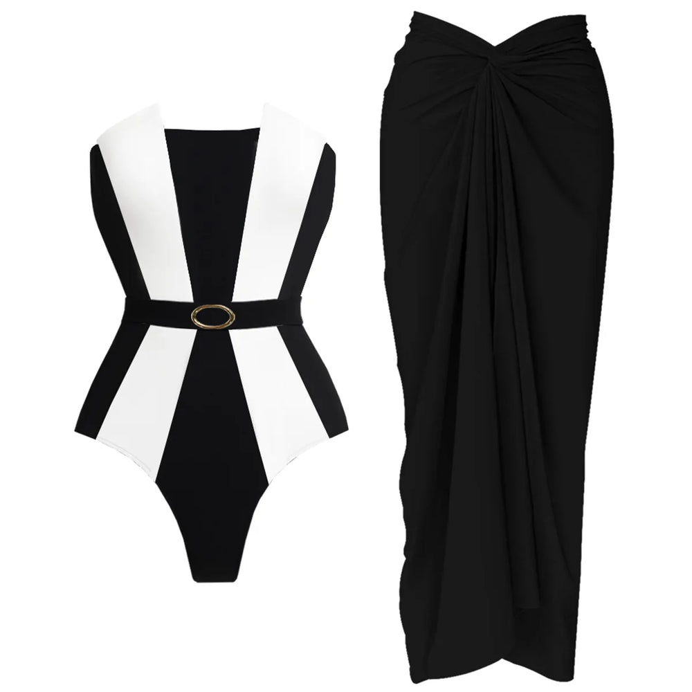 Black and white paneled swimsuit next to a black draped maxi skirt