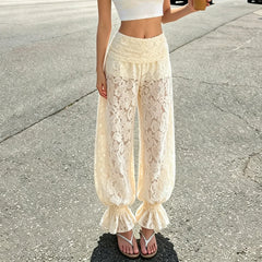 Model wearing floral lace pants with ruffled hem
