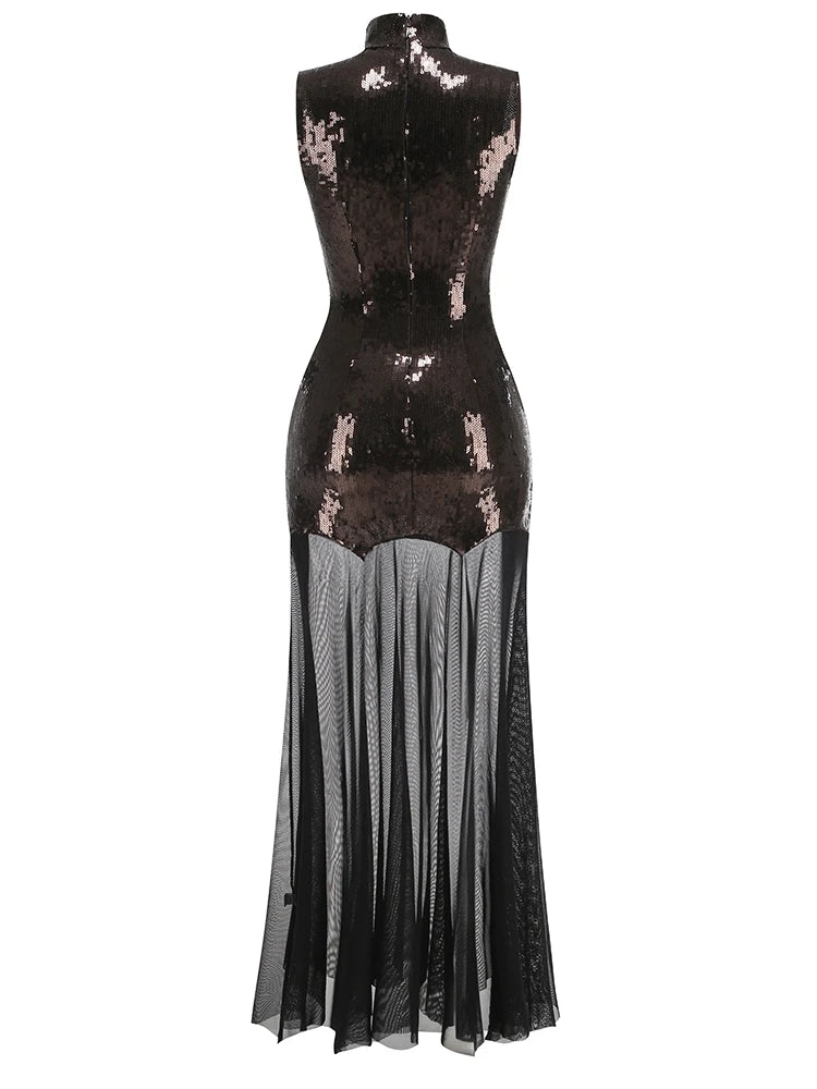 Black sequin dress with sheer overlay on a white background