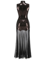 Black sequin dress with sheer overlay on a white background