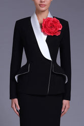 Peplum blazer with contrast lapel and red flower brooch