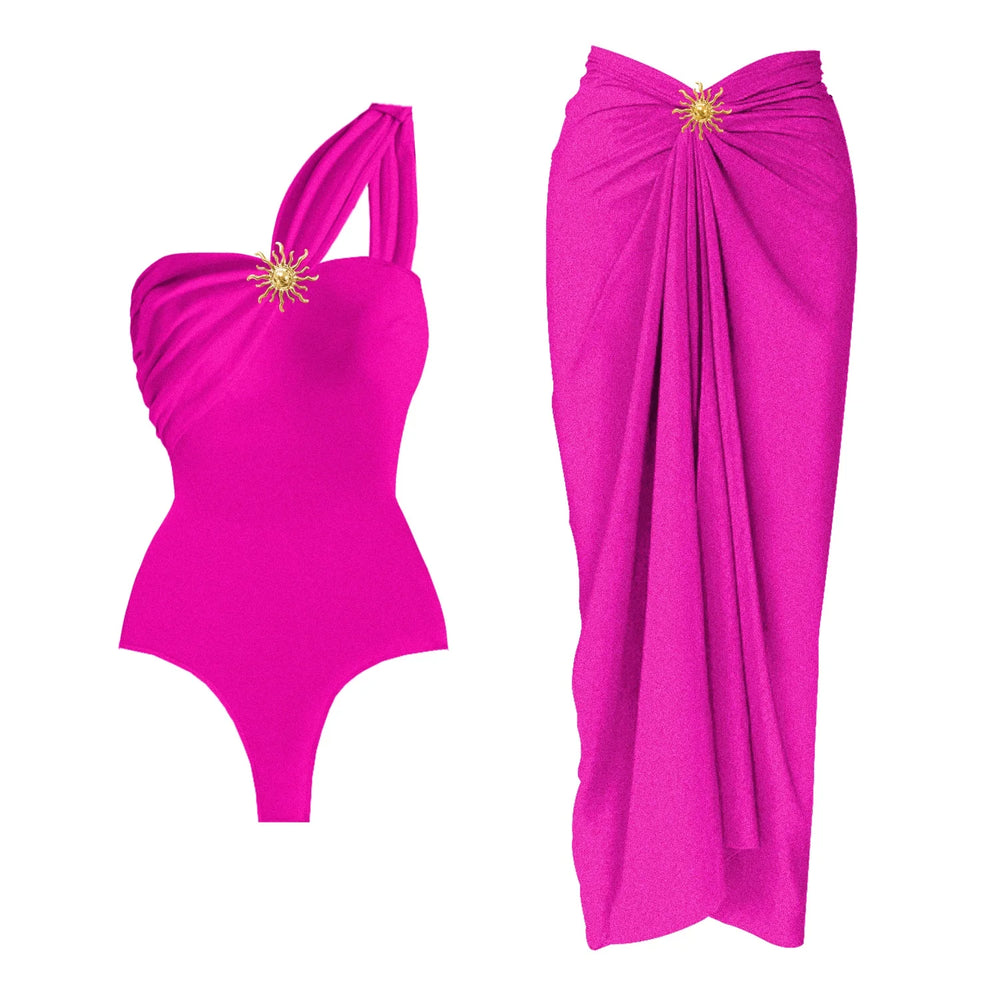 Fuchsia one-shoulder draped bodysuit and wrap skirt set with sunburst embellishment