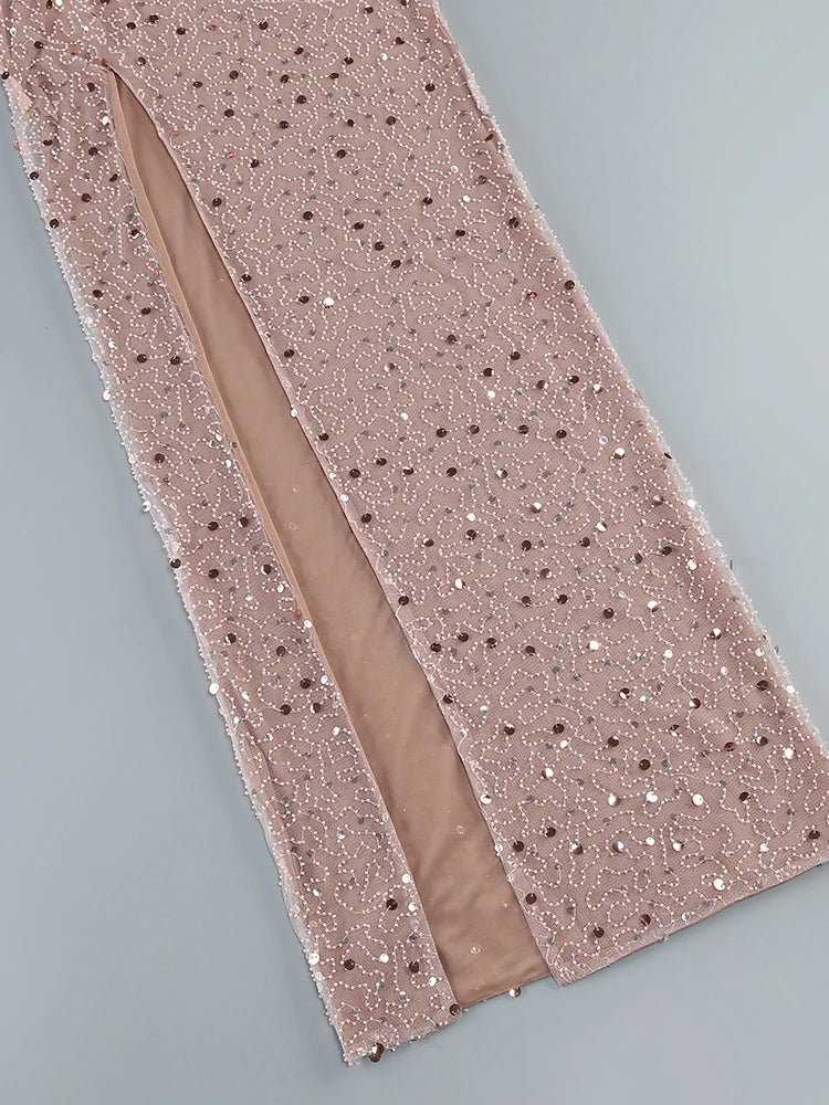 Rose gold sequin fabric on a gray background