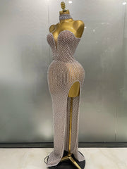 Silver beaded evening gown on a mannequin against a neutral background