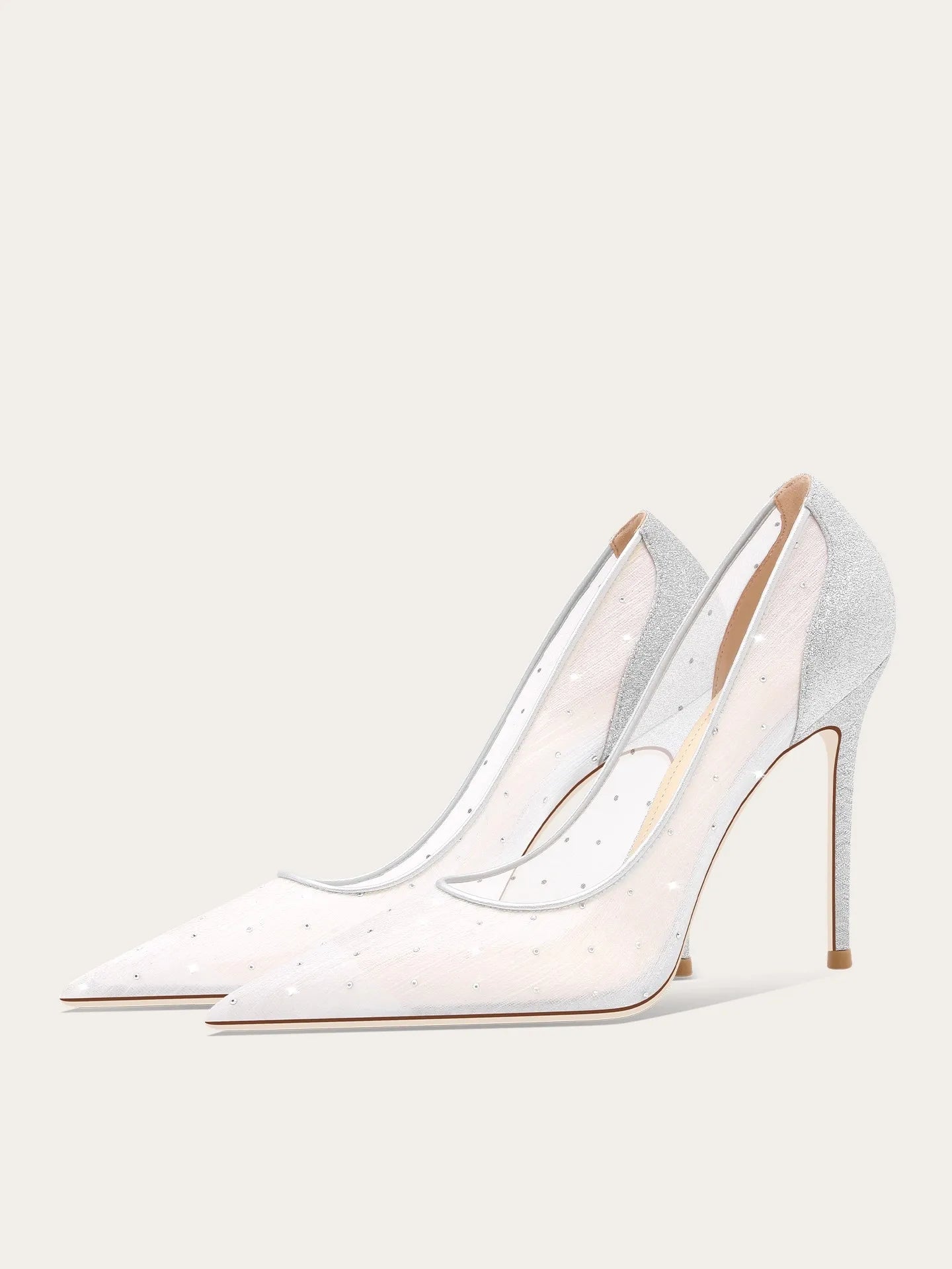 White high-heeled shoes with clear straps on a light gray background