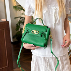 Green structured top handle bag with gold hardware