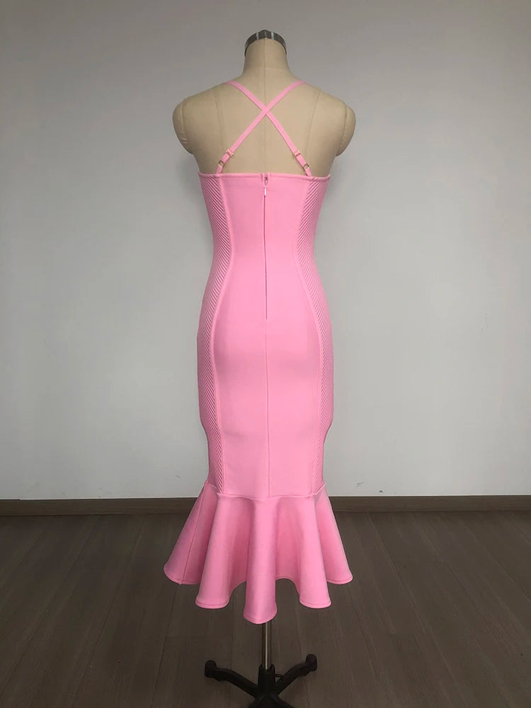 Pink dress on a mannequin against a plain background