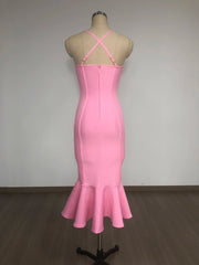 Pink dress on a mannequin against a plain background