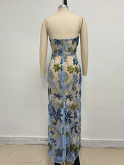 Floral dress on a mannequin against a plain background