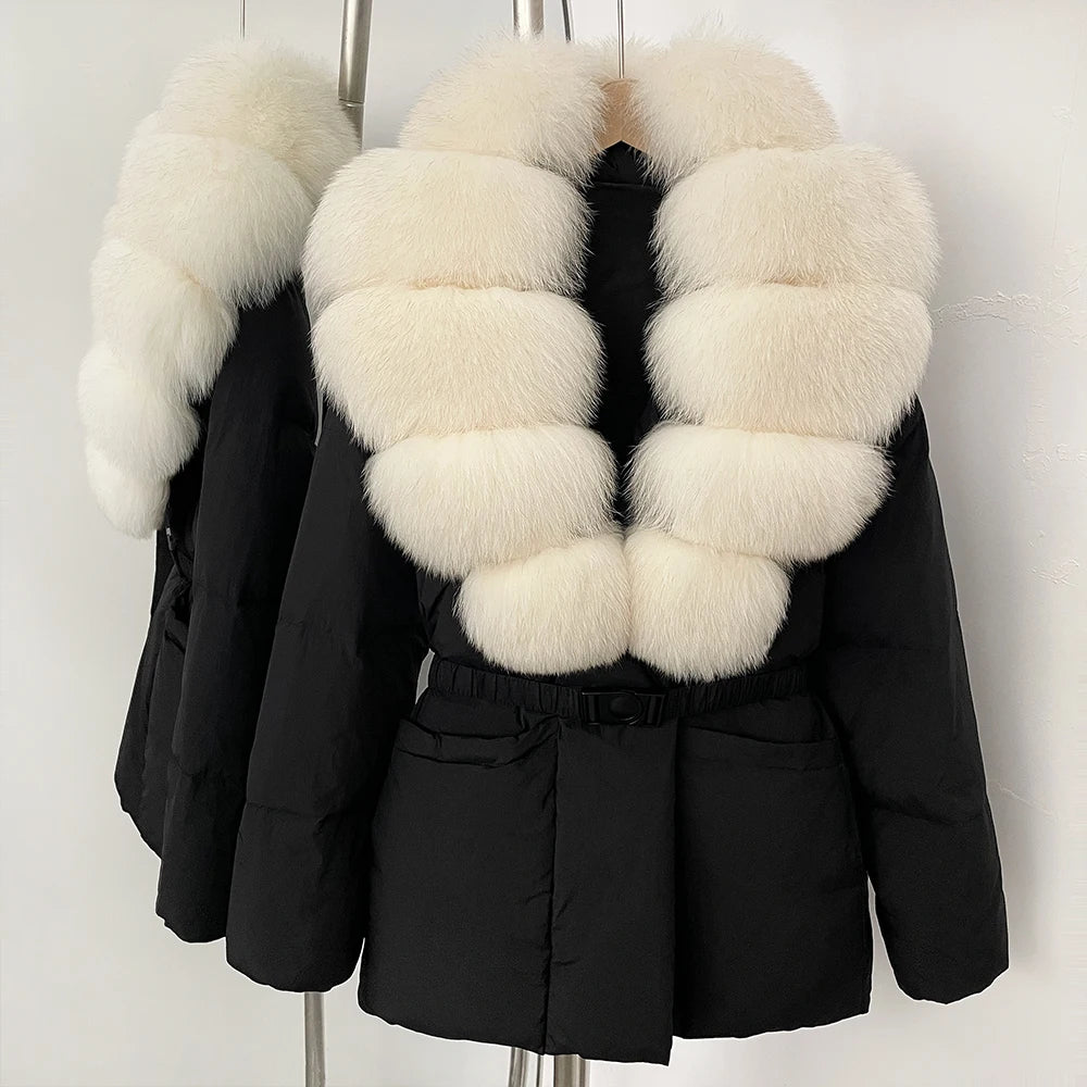 Black winter coat with white fur collar on a mannequin against a white background