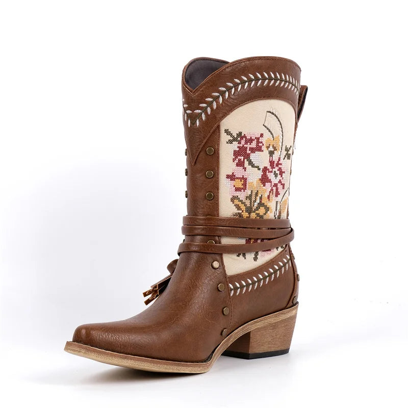 Brown embroidered western ankle boots with floral detailing and wrap strap.
