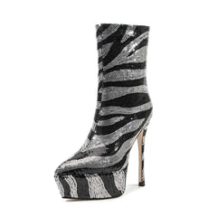 Black and silver zebra-striped high-heeled boot on a white background