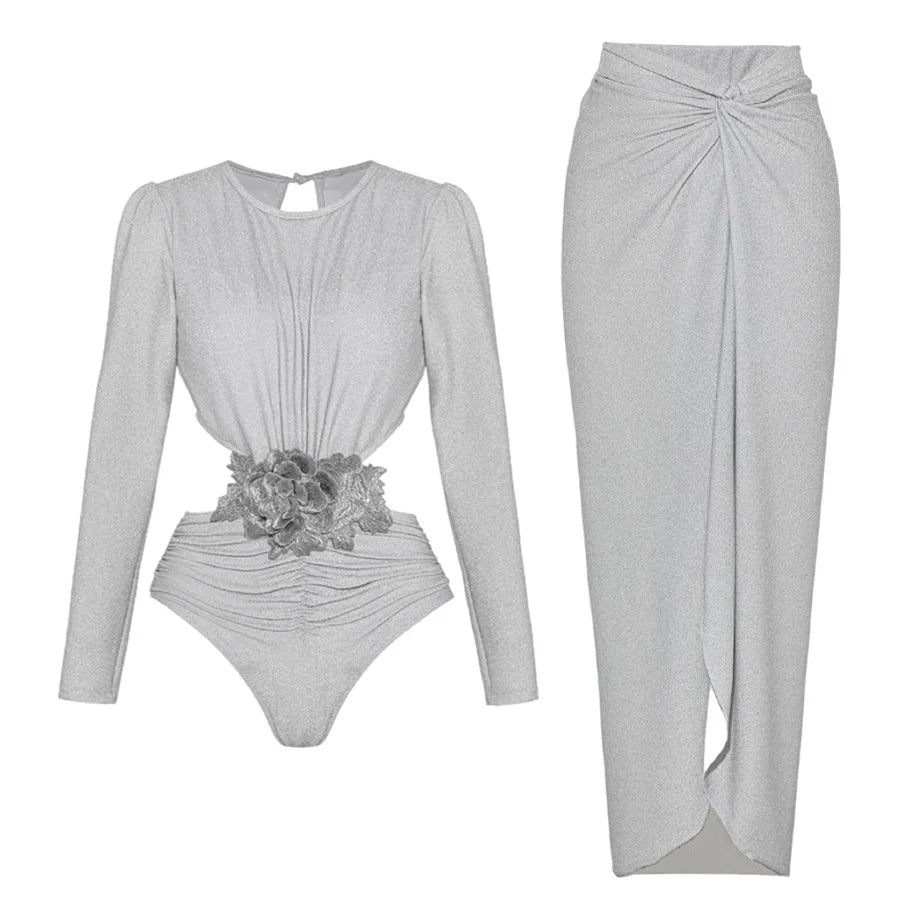 Silver long-sleeved cut-out bodysuit with floral applique and matching ruched wrap maxi skirt.