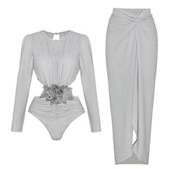 Silver long-sleeved cut-out bodysuit with floral applique and matching ruched wrap maxi skirt.