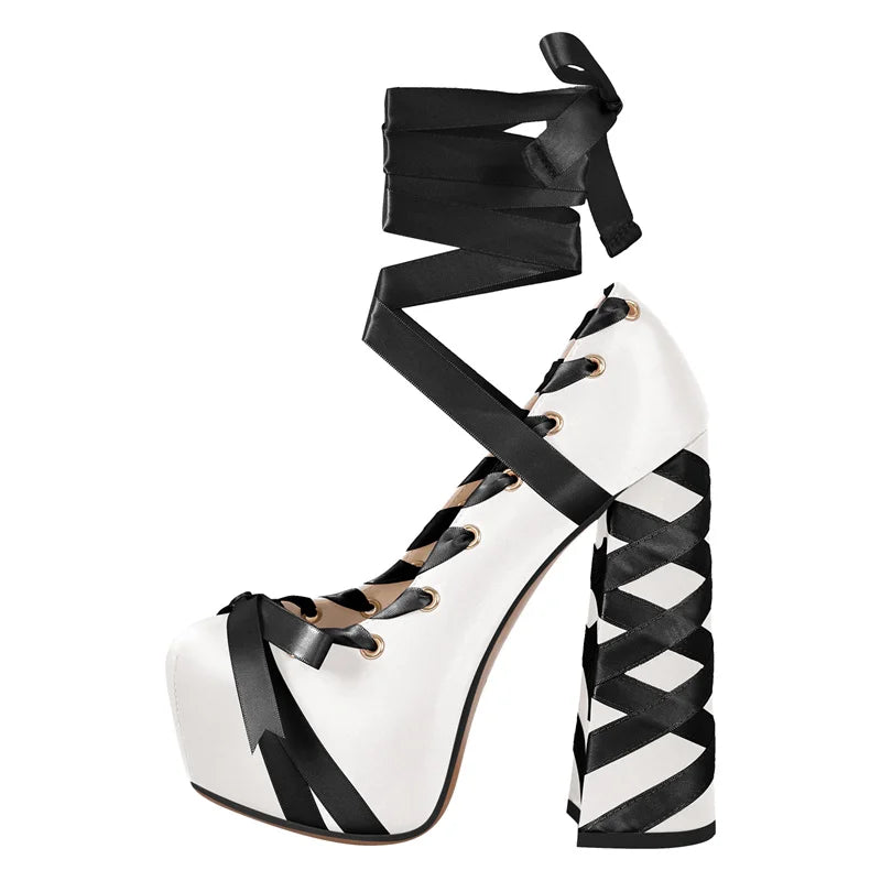 Black and white platform high heel shoe with ribbon detailing on a white background