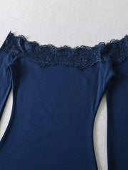 Close-up of the lace trim on the off-shoulder neckline