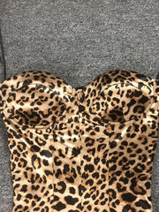 Leopard print strapless top on a gray background