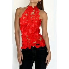 Red floral cutout mock neck halter top shown with black jeans.