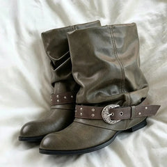 Brown slouch ankle boots with a round toe and decorative buckle strap.