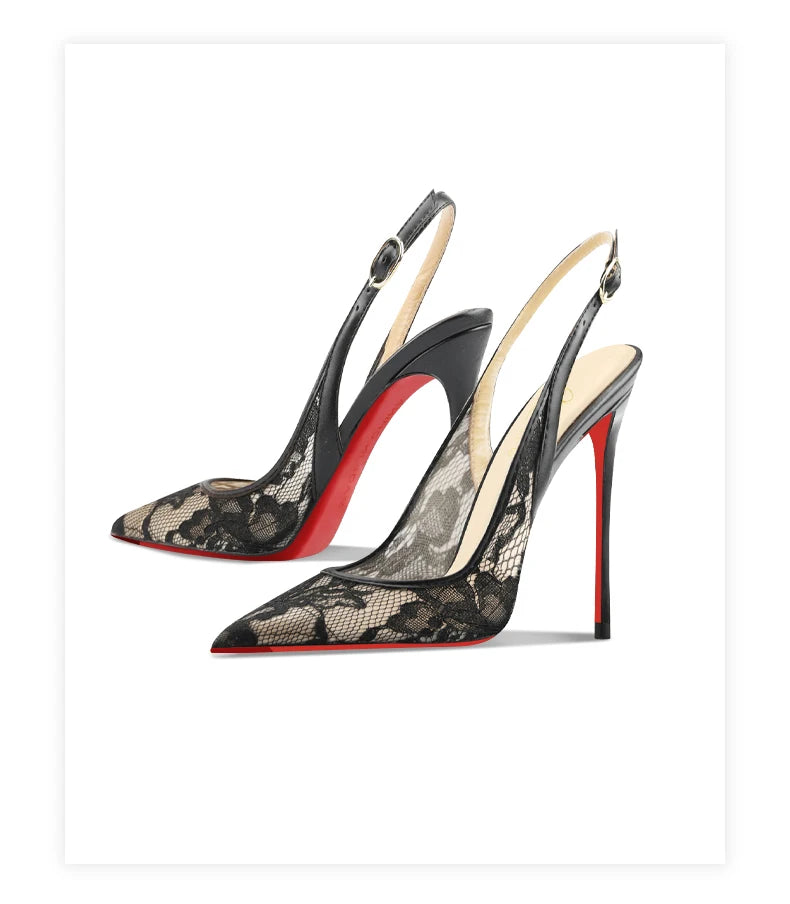 Pair of high-heeled shoes with black lace design and red soles on a white background