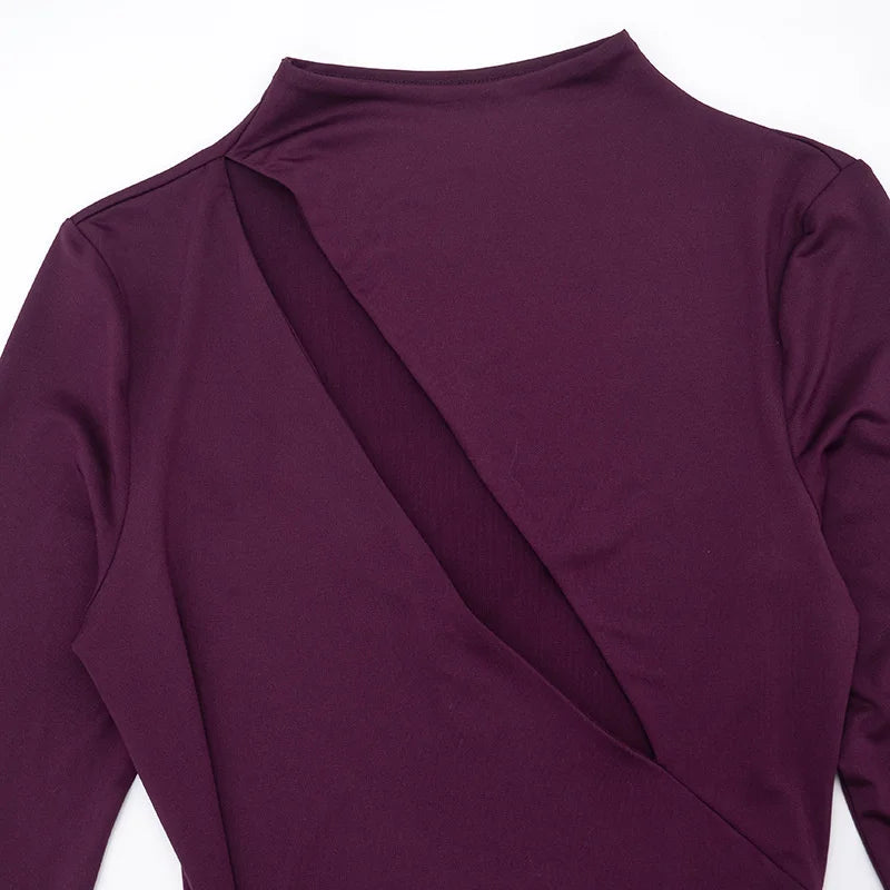 Close-up of a purple long-sleeve top with a draped design