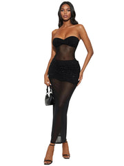 Woman wearing a black strapless top and sheer black pants