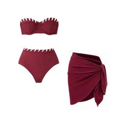 Maroon bikini top and high-waisted bottoms with white contrast trim, and a matching maroon wrap skirt.