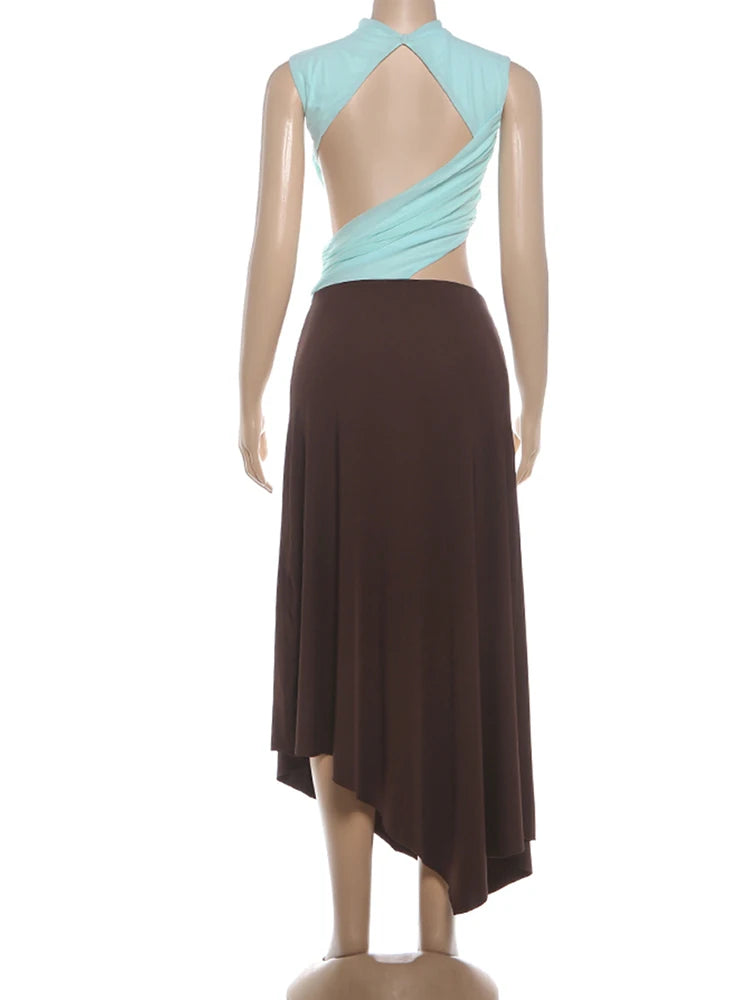 Mannequin wearing a dress with a light blue and brown patchwork on a white background