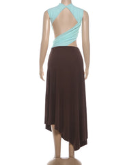 Mannequin wearing a dress with a light blue and brown patchwork on a white background