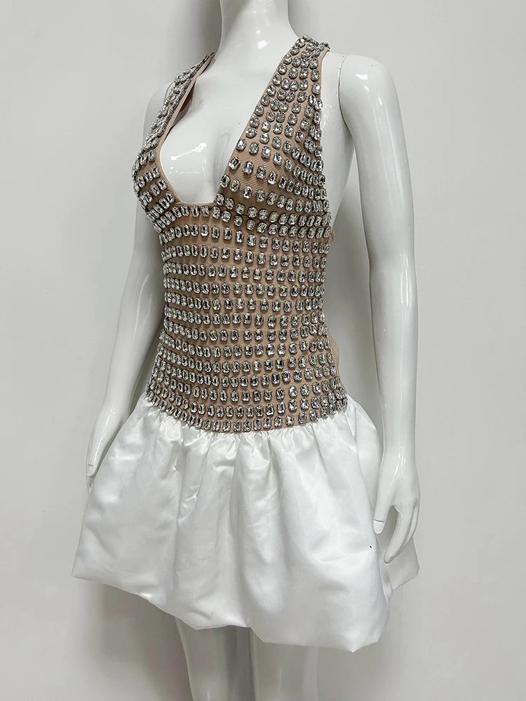 Crystal embellished halter mini dress on mannequin, side view